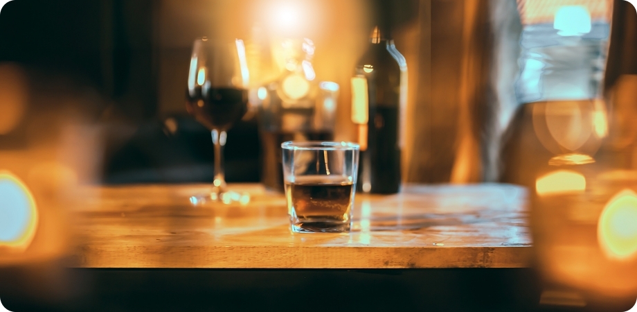 Liquor glasses and bottles representing alcohol sales and Pembroke Pines regulations.