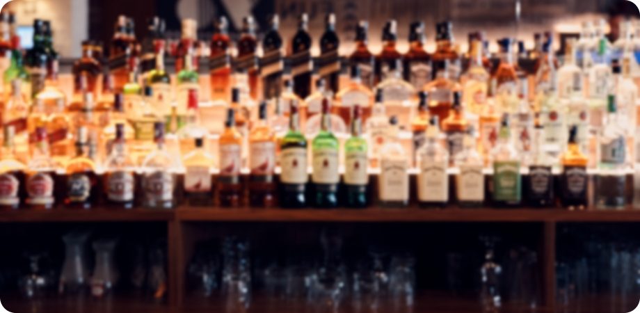 Back bar filled with liquor bottles for West Palm Beach liquor license services